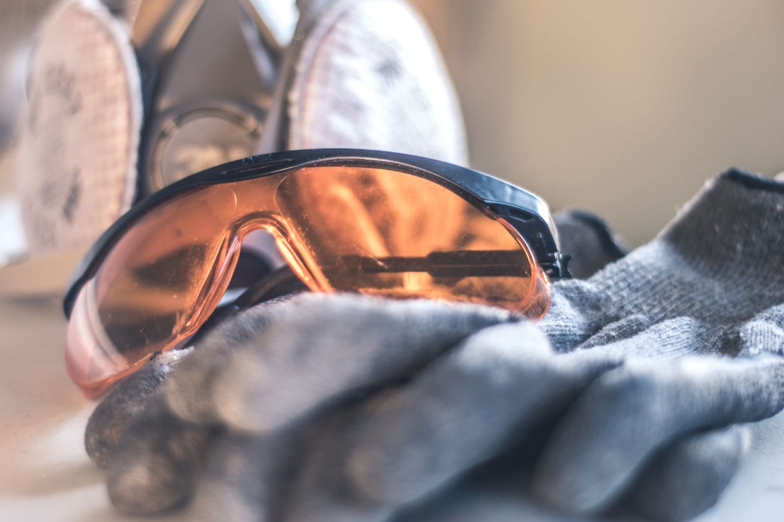 Pest-control safety gear — protective eyewear, gloves and respirator laid out before a job